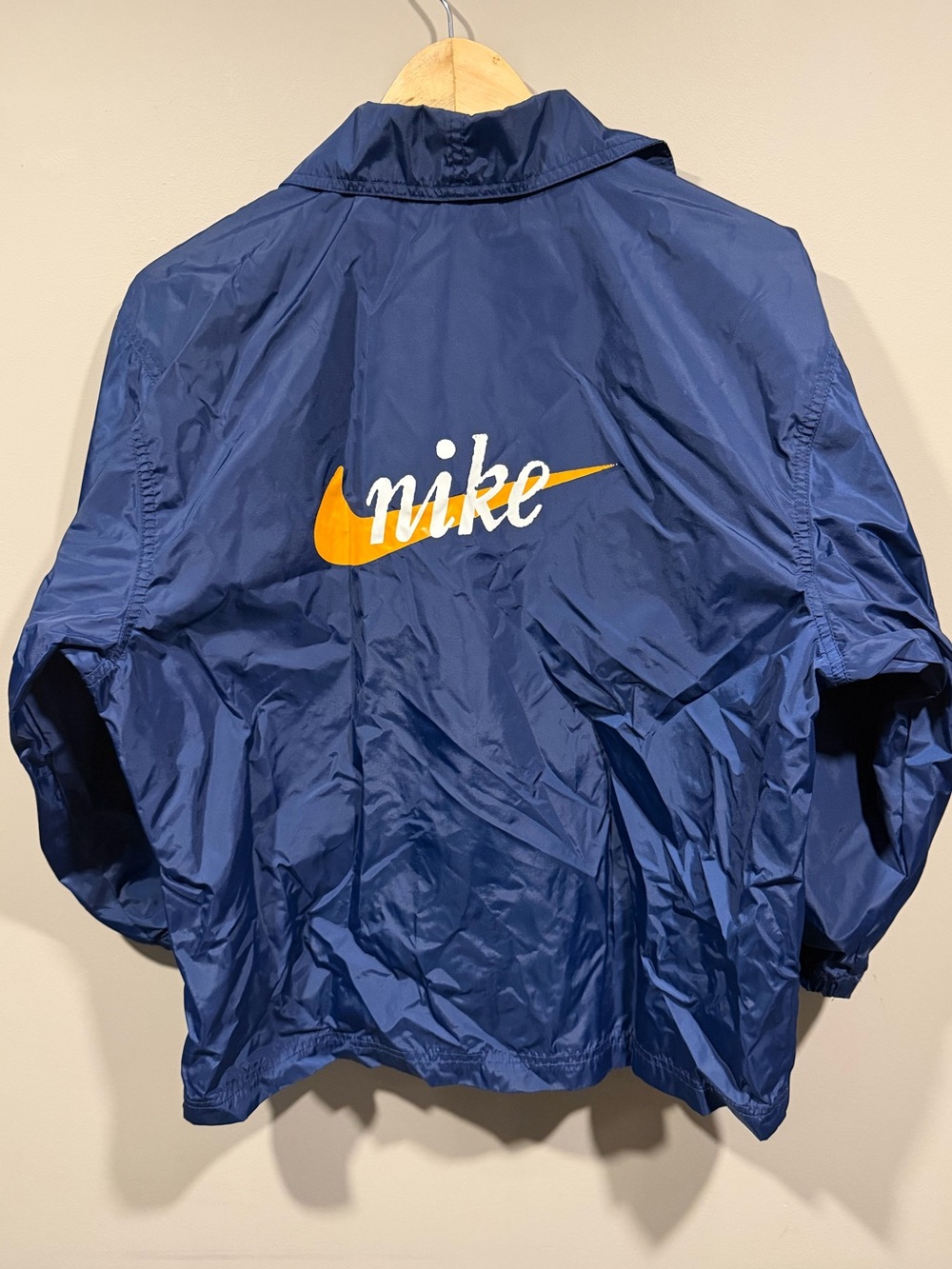 Nike kids Navy Windbreaker Jacket with Orange Swoosh and White Script
